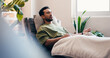 © DavidsPrime/peopleimages.com - Infusion, relax and wellness with man in drip lounge for benefits of antioxidants, minerals or vitamins. Fluid, IV hydration and recovery with person in chair for healthcare or medical treatment