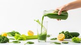 Fresh green juice being poured into a glass with healthy ingredients