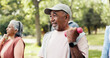 © DavidsPrime/peopleimages.com - Man, dumbbells and old people in park with workout, class and nature for senior fitness club. Retirement, hobby and weights with elderly group, outdoor or exercise together for health and wellness