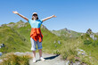 © Elena Medoks - Hiker embracing nature in the swiss alps: feeling joy and freedom in the mountains
