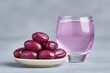 © AnasTruba - Delicate arrangement of sweet dates on a small plate beside a glass of refreshing water. Ramadan Begins