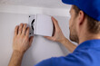 © ronstik - HVAC service worker working on bathroom ventilation exhaust fan