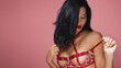 © Buyanskyy Production - Seductive Woman in Red Lingerie with Red Lips, Pink Background Banner