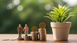 © Artfinity - Retirement savings and pension fund growth concept. Elderly financial security. Miniature senior couple standing on growing stacks of coins next to a green plant in a pot