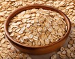 © Cory - oatmeal flakes an overhead view of uncooked oatmeal flakes their light tan color forming a nutritious and versatile base for breakfast