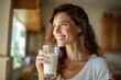 © Serhii - Everyday wellness scene featuring a brunette enjoying milk