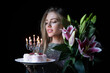 © Volodymyr - Sensual woman celebrating birthday with flowers and cake. Model celebration birthday. Beautiful lady holding bouquet and festive dessert. Romantic birthday. Girl with pink lilies and birthday cake.