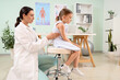 © Pixel-Shot - Female osteopath working with little patient in clinic