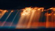 © nur - Dramatic shafts of intense sunlight pierce through heavy, fiery-edged storm clouds above a darkened landscape.