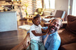 © Davor - Father and daughter laughing together at home