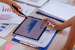 © David - Hands and graphs on tablet screen for finance results, profit growth and budget review. Staff, team and digital with financial report, revenue stats and dividend comparison of risk assessment