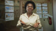 © Krakenimages.com - Black woman showing open palms and speaking in a real estate agency building; concern explanation empathy service.