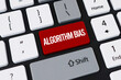 © Reza - Red algorithm bias button on computer keyboard. Concept of AI discrimination, machine learning and data ethics.