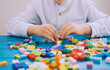 © nataliaderiabina - Child playing and building with colorful toy bricks, plastic blocks.