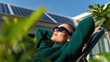 © olgakris - Woman embracing off-grid lifestyle with solar panels in a garden, showcasing energy independence and sustainable happiness, eco-optimism, and future of energy, personal sustainability