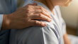 © IPX - Comforting Hand on Patient Shoulder