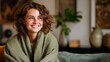 © Newleks - Young woman enjoying quiet moment feeling comfortable and happy at home, smiling with genuine joy, embracing pleasant domestic life and relaxation