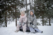 © ADDICTIVE STOCK - Sisters enjoying winter snow in the park