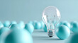 © sornram - A glass light bulb stands out in a sea of blue spheres, symbolizing innovation and creativity in technology and design. Perfect for modern light concepts.