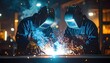 © Leo - Two workers welding metal in a workshop, bright sparks illuminating protective gear