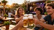 © ibhonk - Four smiling young adults toast with foaming golden beer steins at an outdoor garden party with live music and warm sunset lighting.