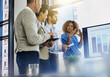 © Beak Joint/peopleimages.com - Business woman, screen or meeting with team for analytics, statistics or performance in office. Female person, employee or discussion with display, graph or chart for review or company improvement