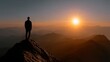 © lekky - Silhouette of a Person Watching the Sunset Over Majestic Mountain Range