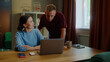 © Татьяна Епанешникова - Boss man checks asian woman subordinate do task correctly report. Management satisfied work. Employee right answer. Good job. Guy show laptop screen. Multi racial national couple online shopping home.