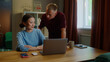 © Татьяна Епанешникова - Boss man checks asian woman subordinate do task correctly report. Management satisfied work. Employee right answer. Good job. Guy show laptop screen. Multi racial national couple online shopping home.