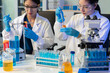 © NINENII - Scientists conducting research in a biotechnology lab, using pipettes and test tubes for medical and chemical experiments. Innovation in chemistry, healthcare, and medicine.