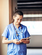 © peopleimages.com - Telehealth, nurse and woman with tablet for reading email, healthcare report or research in clinic. Scroll, medical surgeon and digital technology for hospital results, service and information online