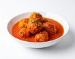 © Serjio - Firefly Spanish Meatballs Albóndigas served in a red sauce with herbs in a white bowl on a plain background