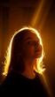© ArtyKris99 - Young woman looking thoughtfully with backlight in warm tones
