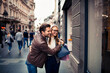 © Davor - Happy couple hugging while shopping on city street