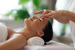© Home-stock - Deep Relaxation. Lady receiving face massage, enjoying pampering in cozy spa salon in luxury resort