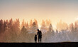 © kieferpix - Parent and Child Walking Together at Sunrise,  Family Bond Silhouette in Misty Forest Morning