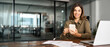 © insta_photos - Smiling mature business woman executive using mobile phone working in office. Happy middle aged businesswoman holding smartphone, professional female executive looking camera with cellphone. Portrait.