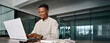 © insta_photos - Busy smiling professional African business man company employee, young male worker businessman wearing glasses typing on computer using laptop working at office, elearning at workplace desk.