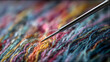 © Erika - acercamiento de las fibras de hilos coloridos para tejer o coser con una aguja sobre los hilos costura hecha a mano moda y artesanias con espacio de copia