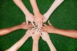 © Rawpixel.com - People stacking hands together in the park