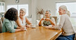 © Kobus L/peopleimages.com - Tea time, friends and mature women in home with conversation, bonding and enjoyment in reunion. Happy, together and senior people in living room with cups, gossip and connection in social gathering.