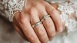 © gundo850 - Elegant Wedding Rings on Bride's Hand with Intricate Lace Detail
