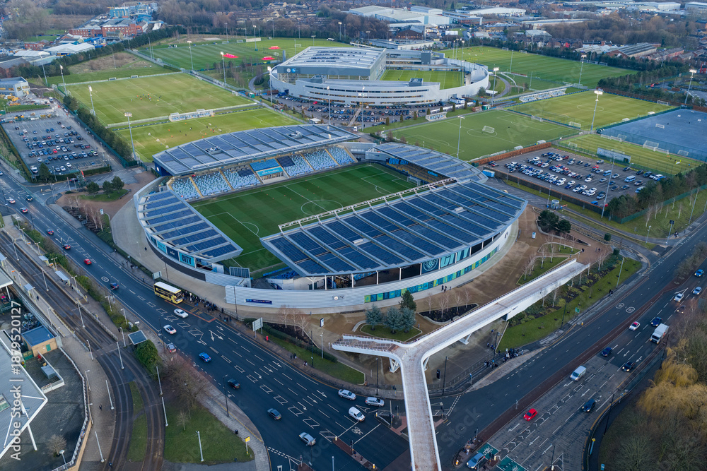 Aerial image of the Etihad Campus in Manchester at sunset, featuring ...