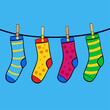 © RAKIBULHASSAN - Colorful socks hanging on a clothesline