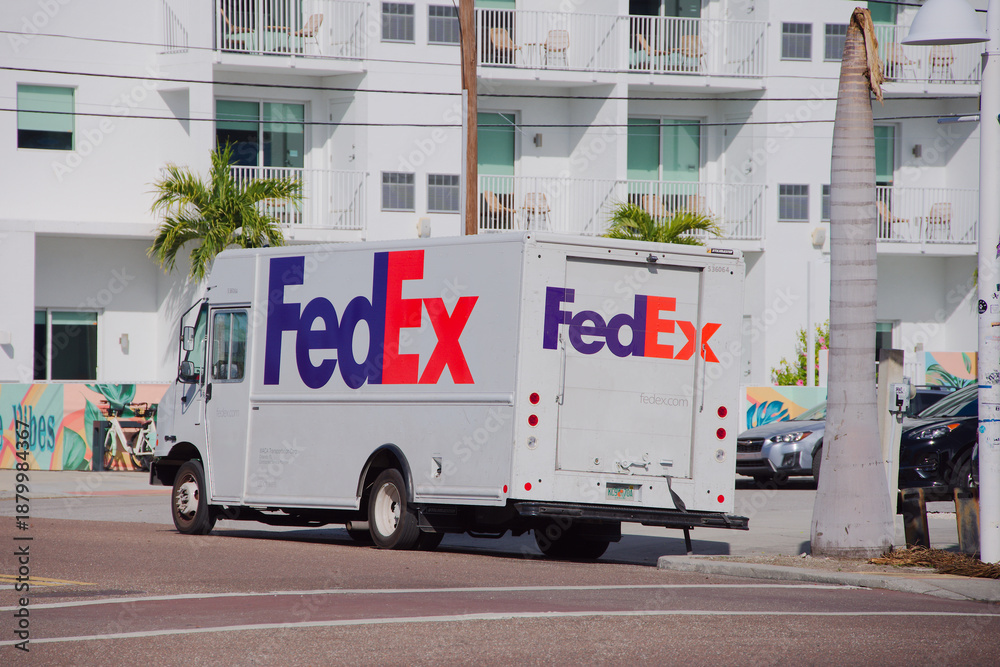 FedEx Delivery Truck Parked Near Modern Apartment Complex With Palm ...