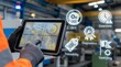 © Love 4 YOU - Industrial worker using tablet with technical diagrams in factory setting
