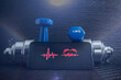 © Floren Horcajo - Smartphone screen showing heart rate and heartbeat icon alongside blue dumbbells, representing digital health and fitness