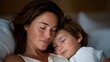 © forenna - Tired mother lying beside her child at bedtime, closed eyes and gentle presence expressing love, sacrifice, and physical exhaustion. cinematic color correction, natural uneven lighting yet gentle