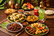© Zulfikri Rosyid - Eid Al-Fitr Food Table Featuring Rendang, Ketupat Rice Cakes, and Curry