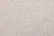 © New Africa - Texture of white knitted fabric as background, top view